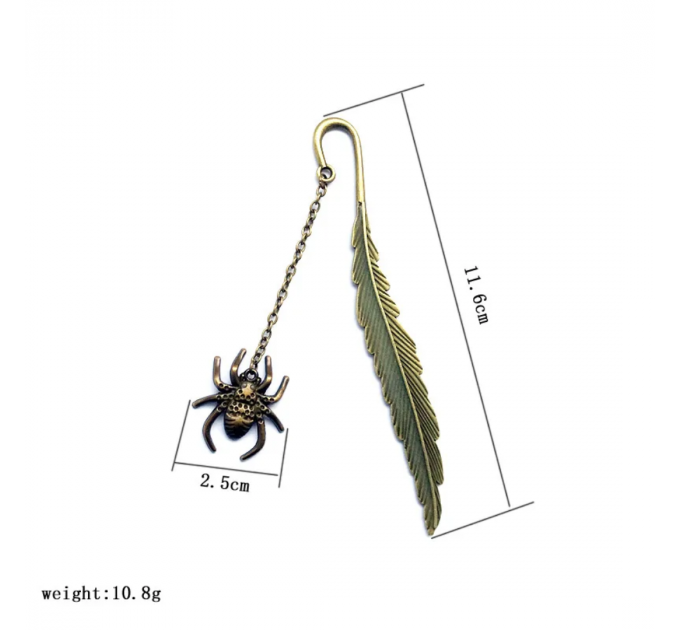 Металева закладка для книги з павуком і пером, що світиться вночі